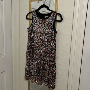 10/12 kids dress but fits an XS to S women’s. Sparkle sequins and stretchy.